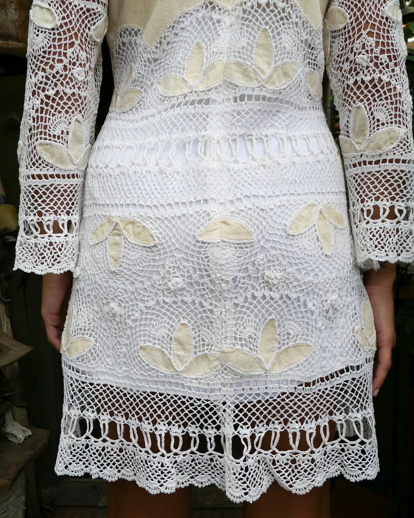 Closeup of bottom crochet hem of dress in the back. 