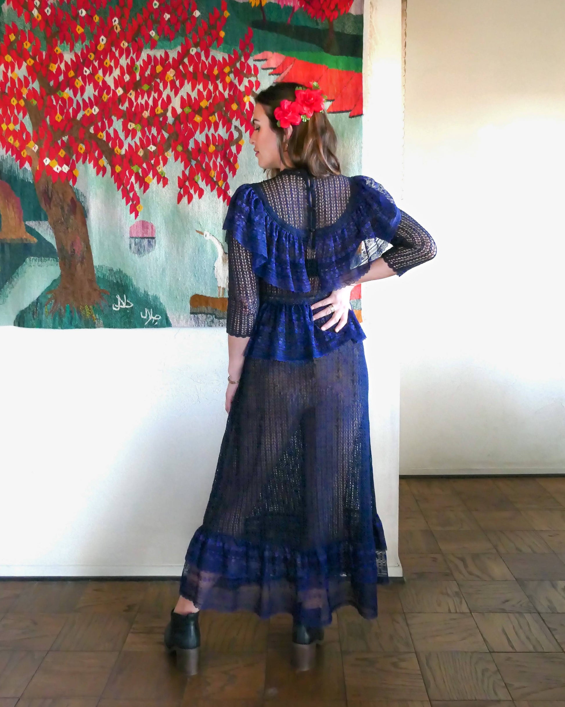 A sultry indigo blue Victorian style crochet maxi dress with lace trim and elastic waist. Can be worn with the buttons going down the front or back. Wear with a slip and high black boots for a dramatic evening look.  Size: Fits small to medium   Measurements:  Bust 31"-36” Waist 26”- 34" Length 52” Shoulder width 15” Sleeve 18” Hip 46"