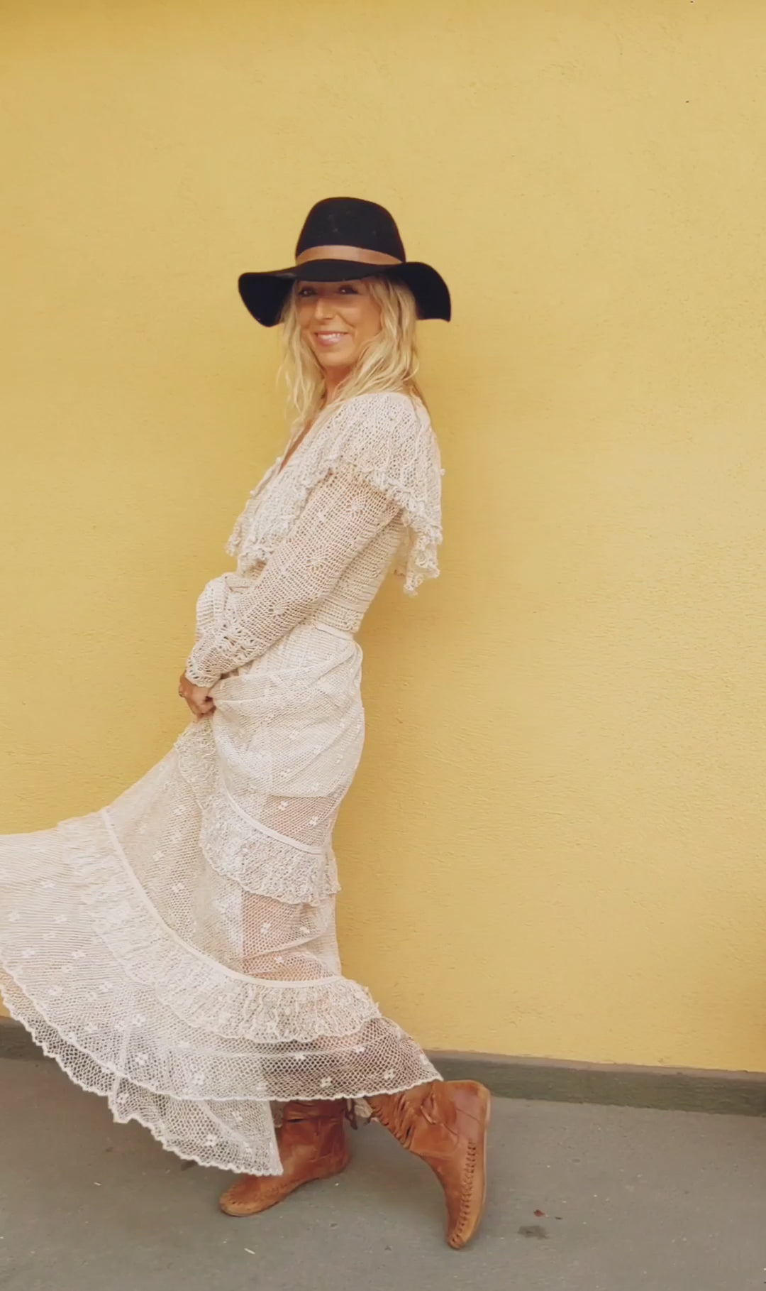 Video of model wearing Natural colored Lim's crochet maxi dress with ruffles and two-tiered ruffled hem.  