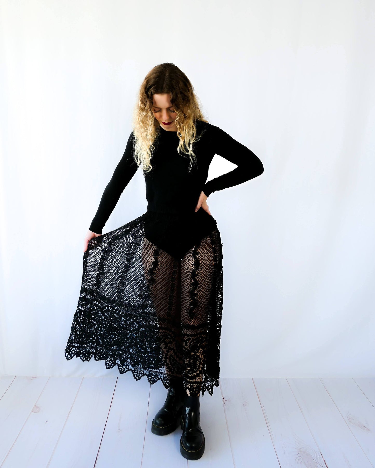 Fall in love again with this original Lim's bohemian, whimsical black hand crocheted, maxi length skirt. Lovely paisley motif at the bottom hem, with vertical lines throughout the dress composed of intricate pinwheel-like circles and squiggly lines dotted with flowers. Looks stunning paired with a black silk camisole and bikini shorts, or a black sweater or crop top and a pair of boots.  Size: Fits Small to Medium﻿  Measurements:  Waist 26"- 30" Length 38" Hip 55” Color: Black  Material: 100% cotton