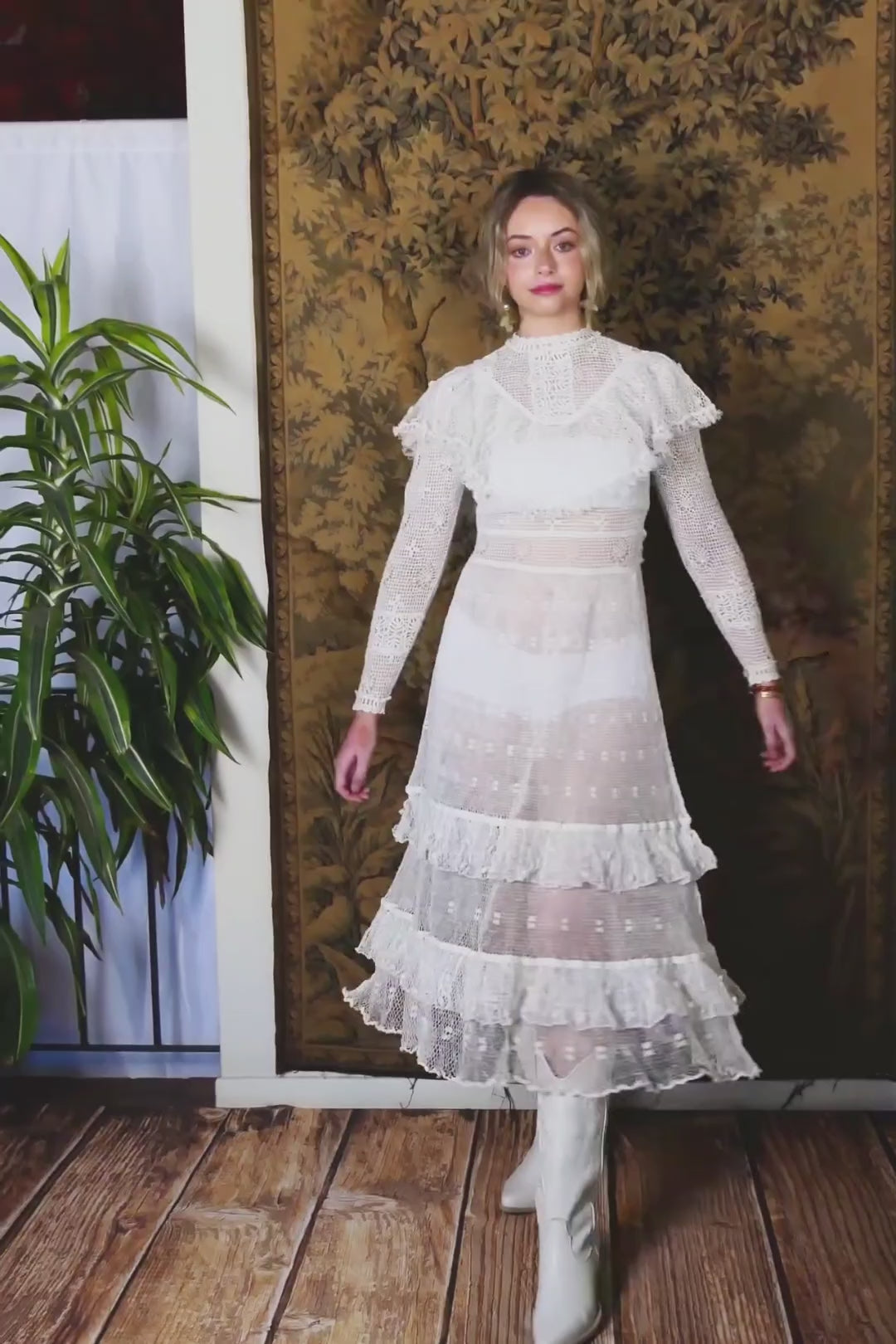 Video of model twirling around in Lim's white crohet maxi dress with two-tiered ruffled hem and ruffles at the collar.  