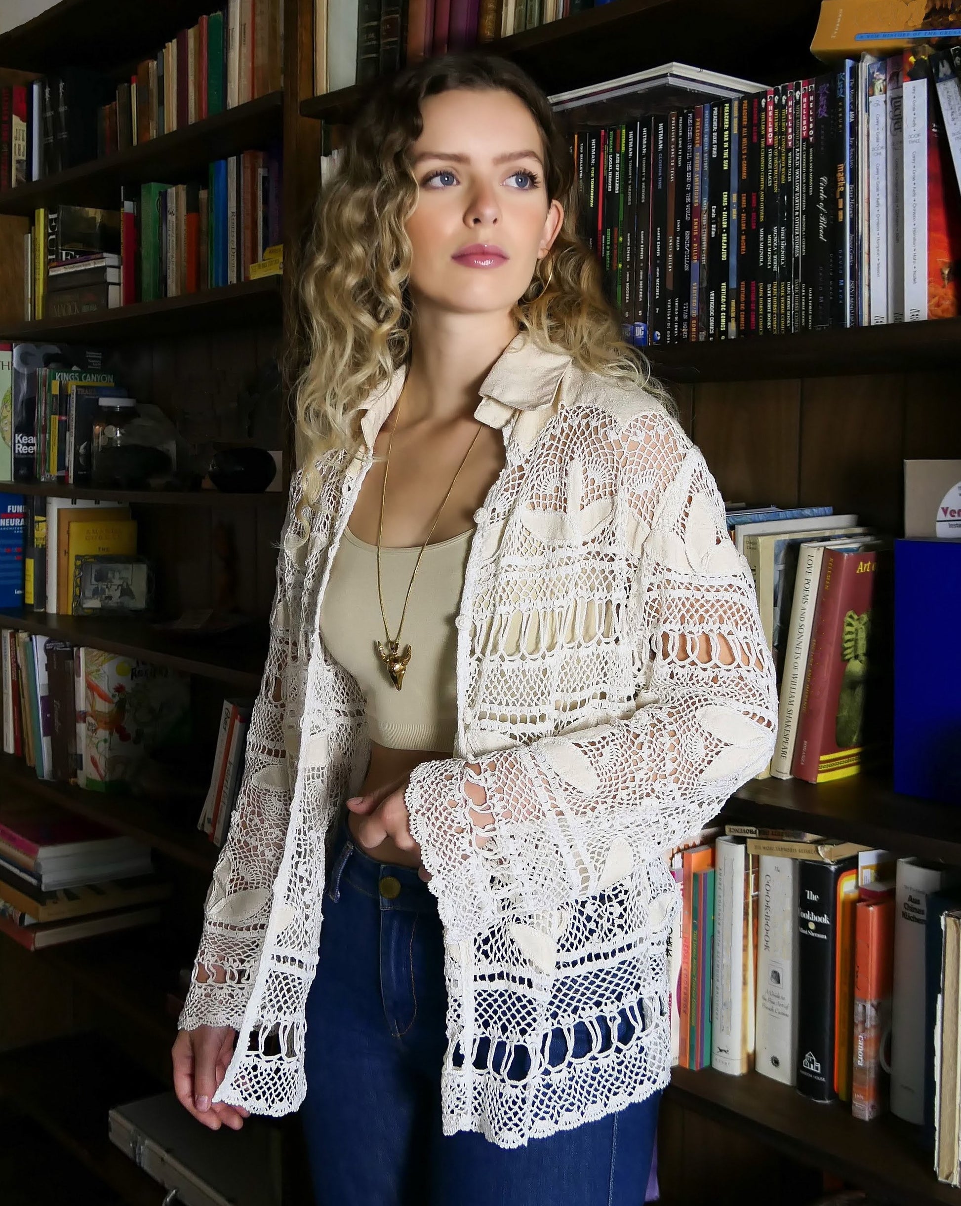 The perfect beach coverup top for your next getaway. An oversized hand crocheted button down top embellished with raw silk leaf-like cutouts. Looks great with a bralette and jeans, or a pair of white wide leg cotton pants, a straw hat, and flip flops.