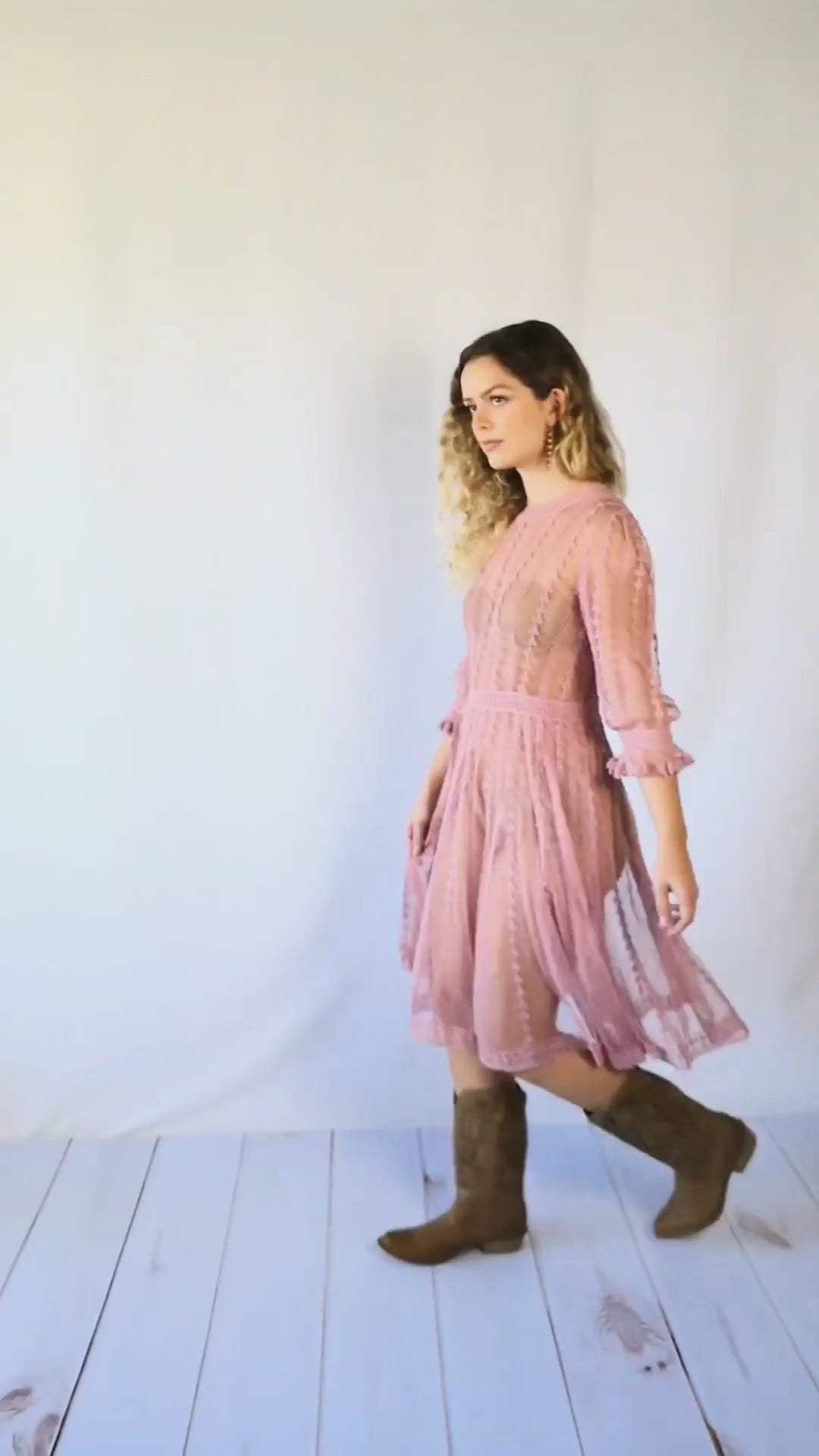 Video of model twirling around in midi length rose colored Lim's Vintage crochet dress.  