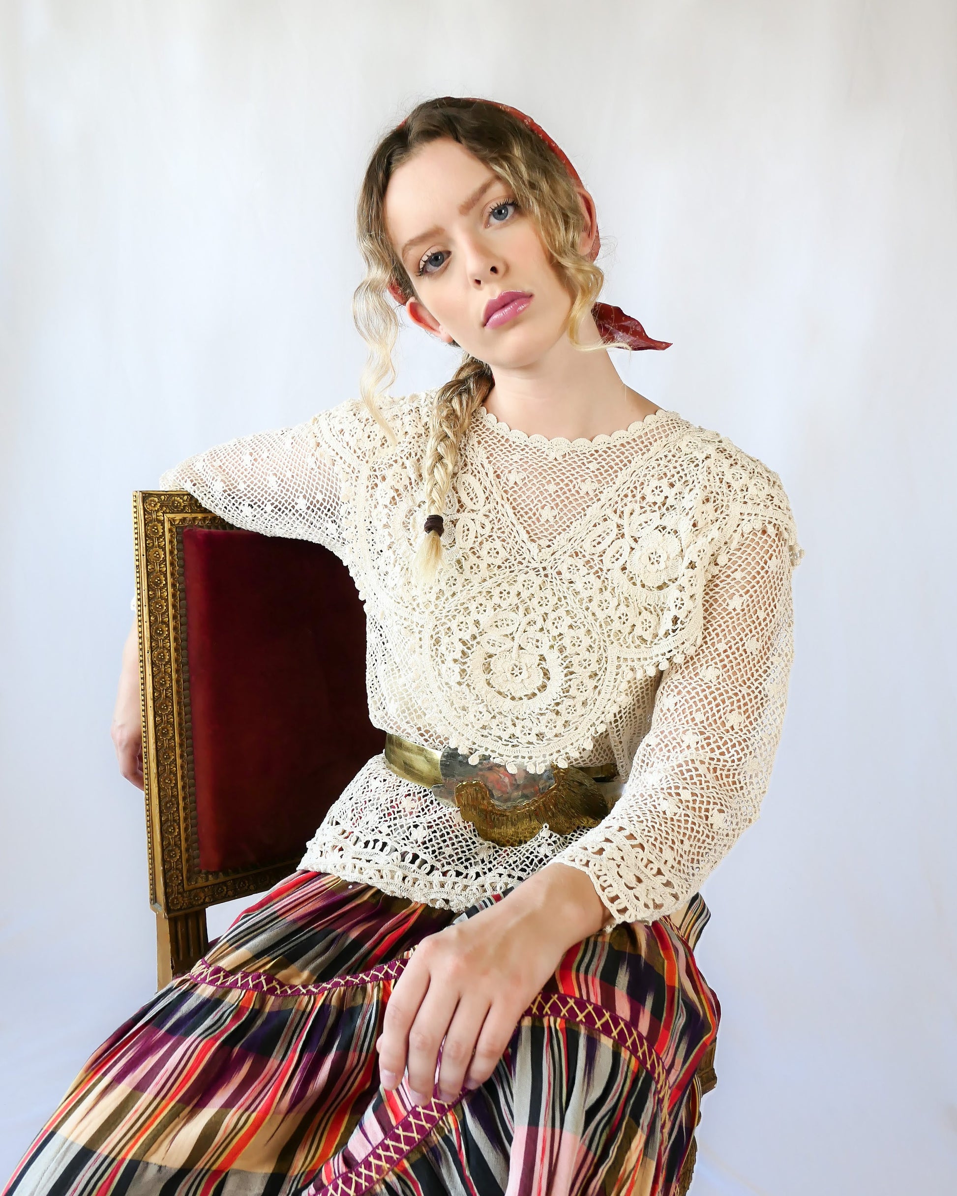 A cottagecore crew neck long sleeve top with intricate hand crocheted floral detail at the collar, hem, and sleeves. This timeless piece is an original Lim's top from the1980s and in excellent condition.  Natural color.