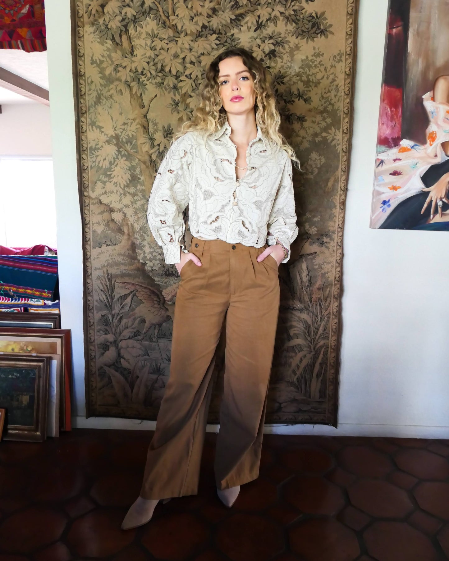 An almost crop top with a relaxed fit and warm neutral tones of cream and taupe, made with our signature Lim's Vintage embroidered cotton fabric. Comes with romantic puffed long sleeves and a scalloped hem. Wear it buttoned or unbuttoned, with wide leg fall colored slacks or jeans and leather boots.