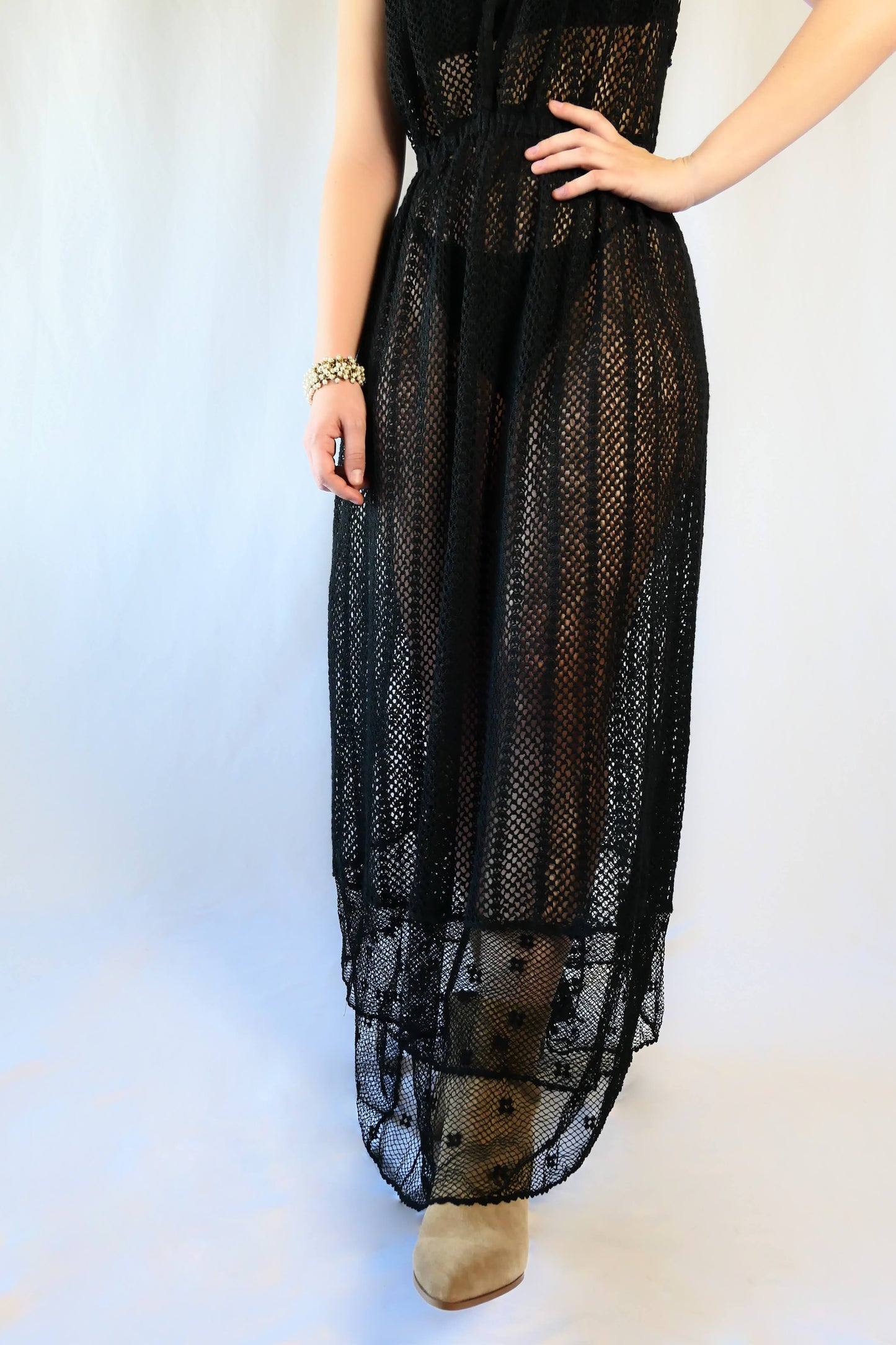 This boho chic dress in black is completely hand crocheted with soft cotton threads, with a Lim’s classic delicate net patterned crochet at the bottom hem.   The dress is worn with the button open at the front for a flattering V-neckline.  