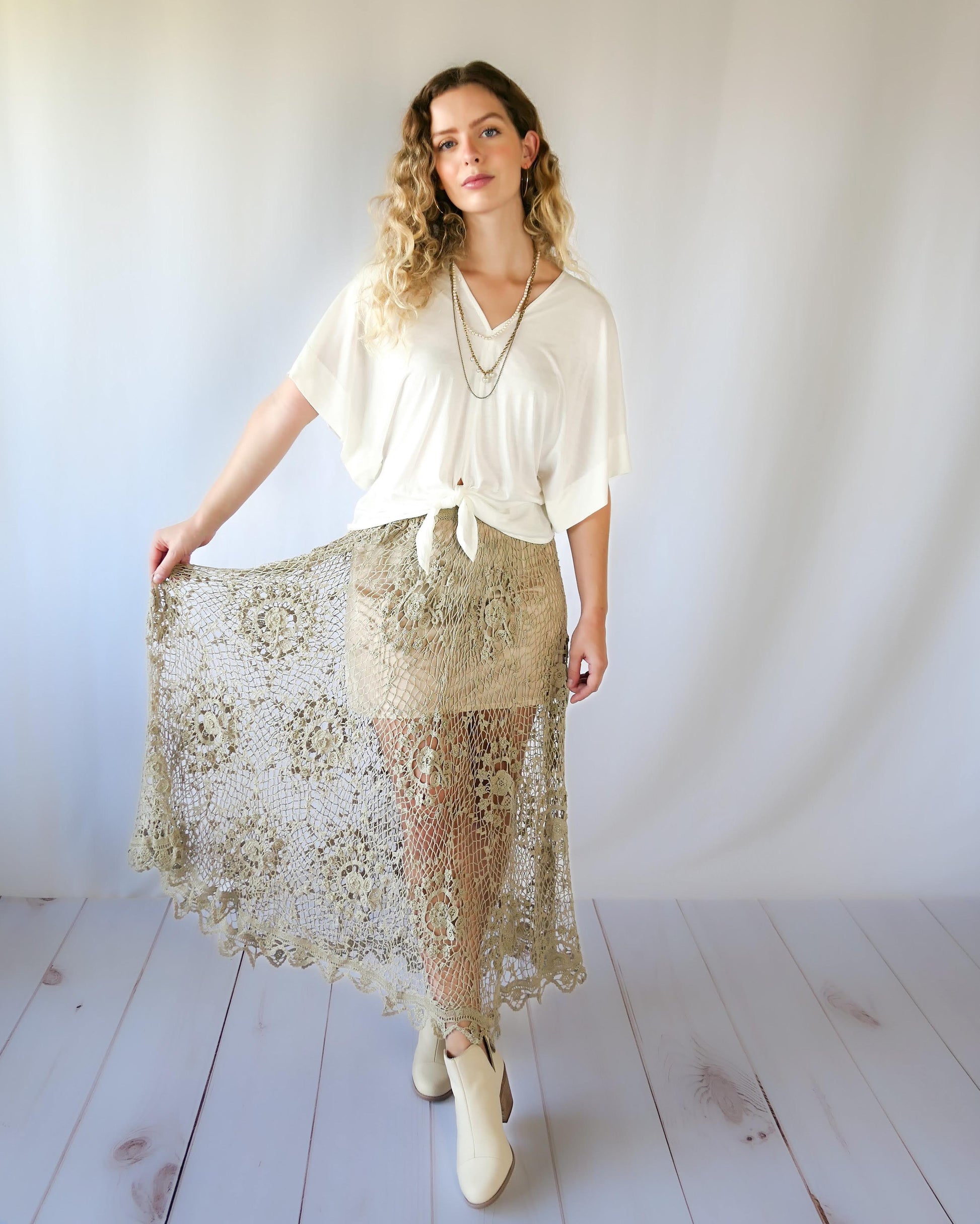 The ultimate cowgirl romantic hand crocheted maxi skirt with a circular floral design against a fishnet-like backdrop. This is an original Lim's piece from the 1980s and is truly a vintage collector's item!