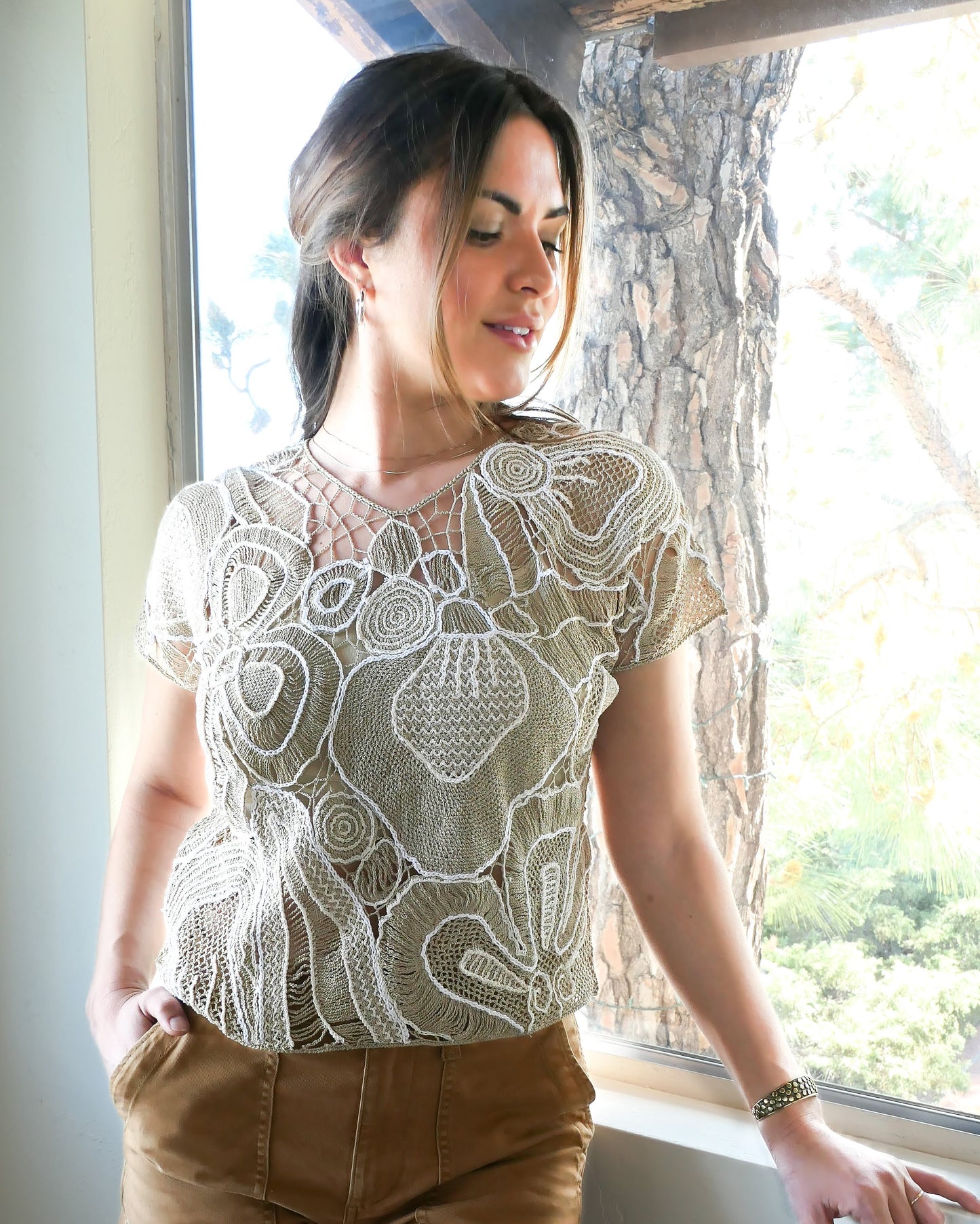 Refresh your wardrobe with this abstract floral patterned hand crocheted Lim's Vintage original high V-neck pullover top from the 1980s in neutral tones of taupe and white.  Pair it with jeans or shorts and sandals, or dress it up with a flowy skirt and wedges for a night out on a warm, summer's eve.