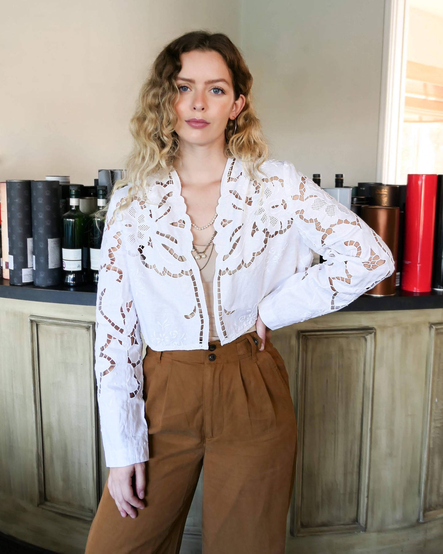 An elegant, lightweight crop bolero jacket made with intricate cutout and hand embroidered Lim's Vintage fabric. Pair it with your favorite wide leg pants and vintage leather boots.