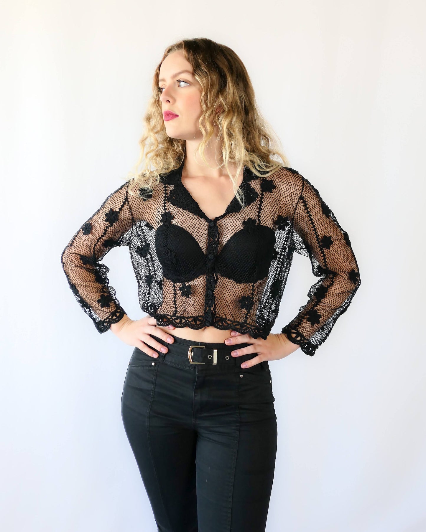 One of our original Lim's hand crocheted long sleeve cardigans from the 1990s, this versatile, semi-revealing cropped cardigan is casual yet provocative. Sheer, with a relaxed, easy fit and embellished with dainty hand crocheted flowers throughout. Dress it down with a pair of jeans and sandals, or dress it up with a pair of slacks or skirt and heels for a night out.  Measurements:  Bust 40" Length 17" Sleeves 20" Shoulder width 15" Hem 34" Color: Black  Size: Medium  Material: 55% linen 45% cotton