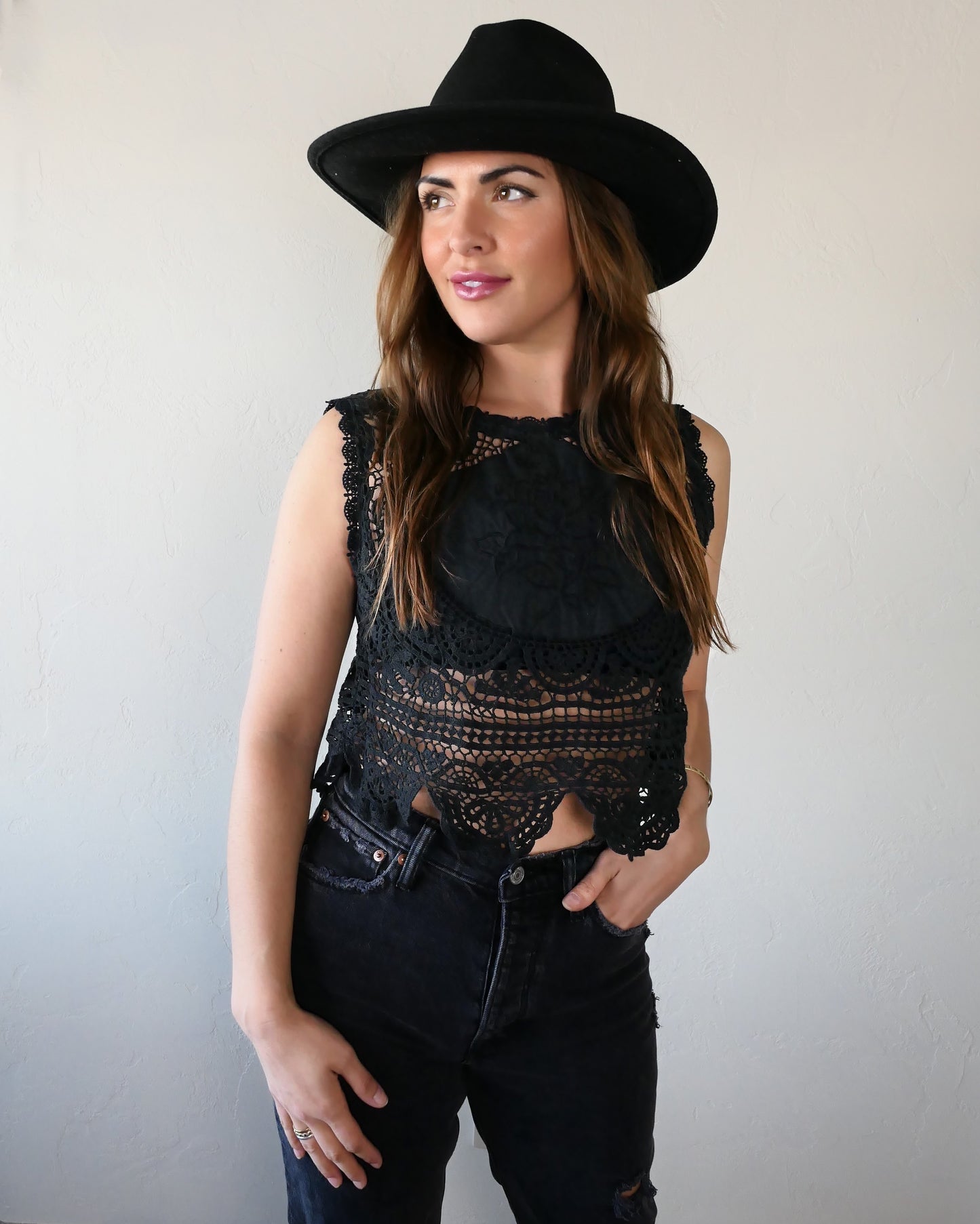 Get ready to rock and roll with our vintage crochet and embroidered patchwork crop tank top that has both an edgy and feminine vibe. We've used one of our vintage rose motif embroidered patchwork fabrics to make this limited edition, one-of-a-kind top. Looks great with a pair of black jeans, boots, and a cowboy hat.
