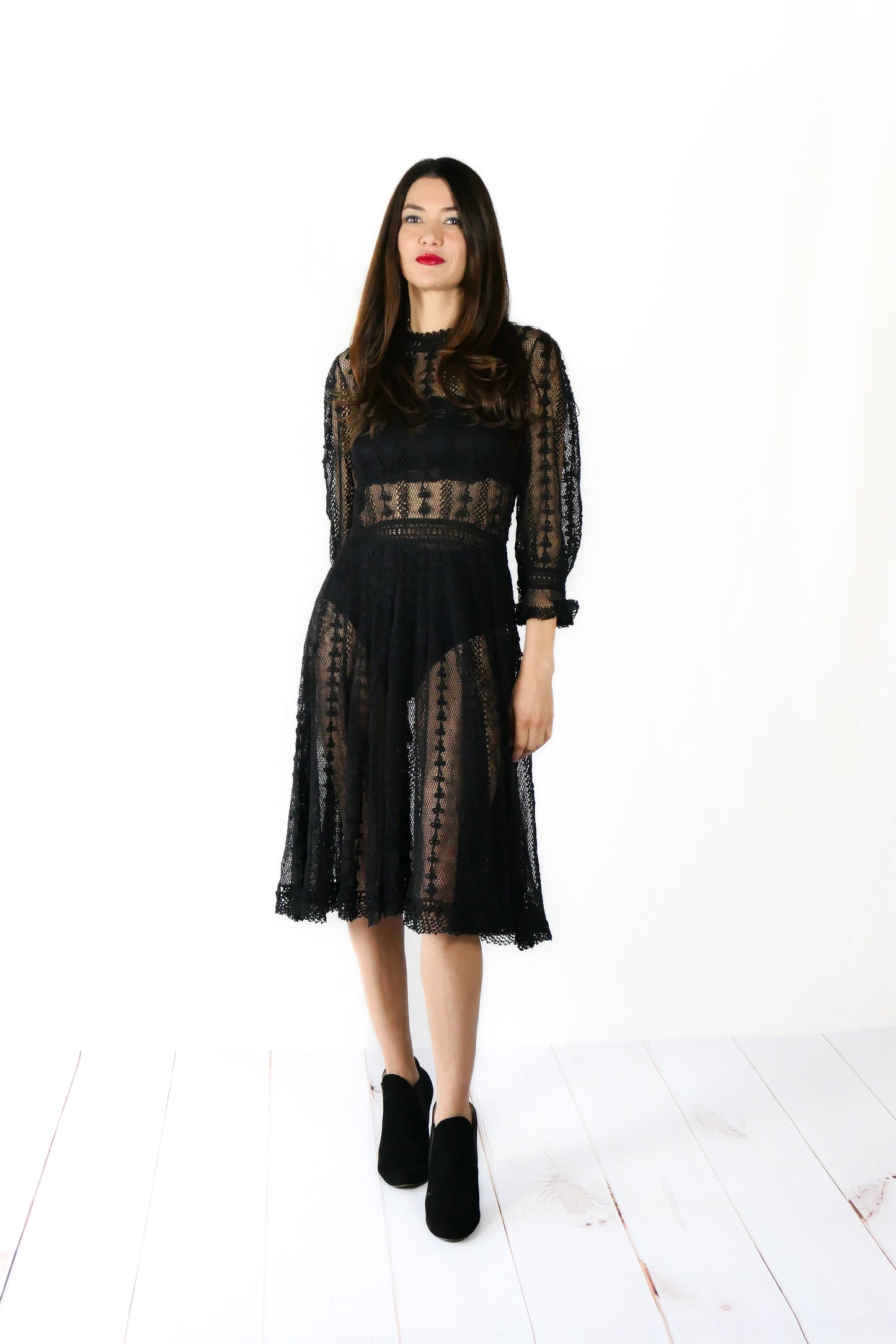 A beguiling black version of our cottage core style midi length crochet dress, this dreamy Lim's original vintage piece from the 1980s is made with very fine threads, creating a refined and sheer look. Detailed crochet trim is used at the waist, hemline, and 3/4 length ruffled sleeves. Measurements: Bust 36” Waist 30” Length 42” Shoulder width 15” Sleeve 20” Cuff circumference 9" Color: Black