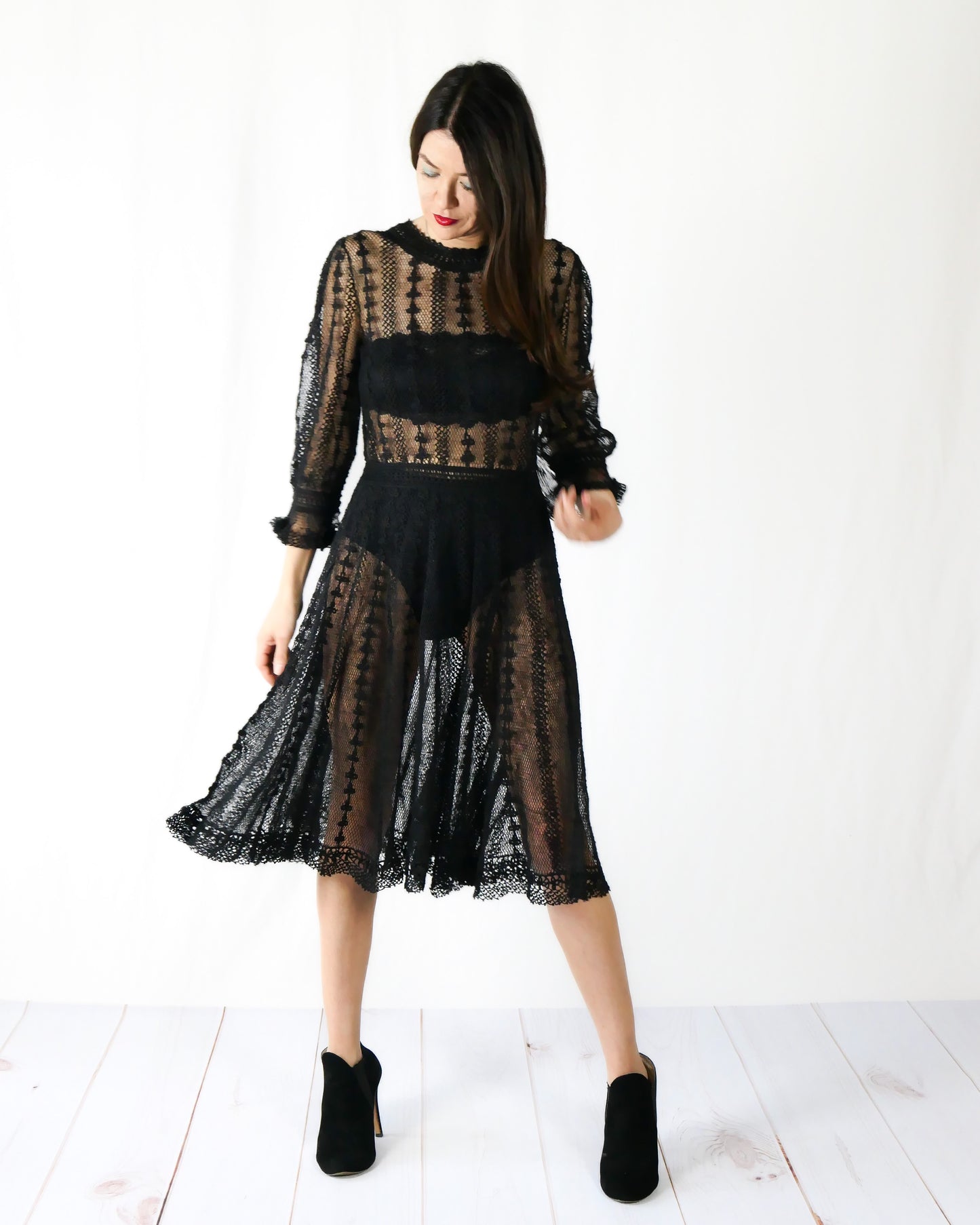 A beguiling black version of our cottage core style midi length crochet dress, this dreamy Lim's original vintage piece from the 1980s is made with very fine threads, creating a refined and sheer look. Detailed crochet trim is used at the waist, hemline, and 3/4 length ruffled sleeves. Measurements: Bust 36” Waist 30” Length 42” Shoulder width 15” Sleeve 20” Cuff circumference 9" Color: Black