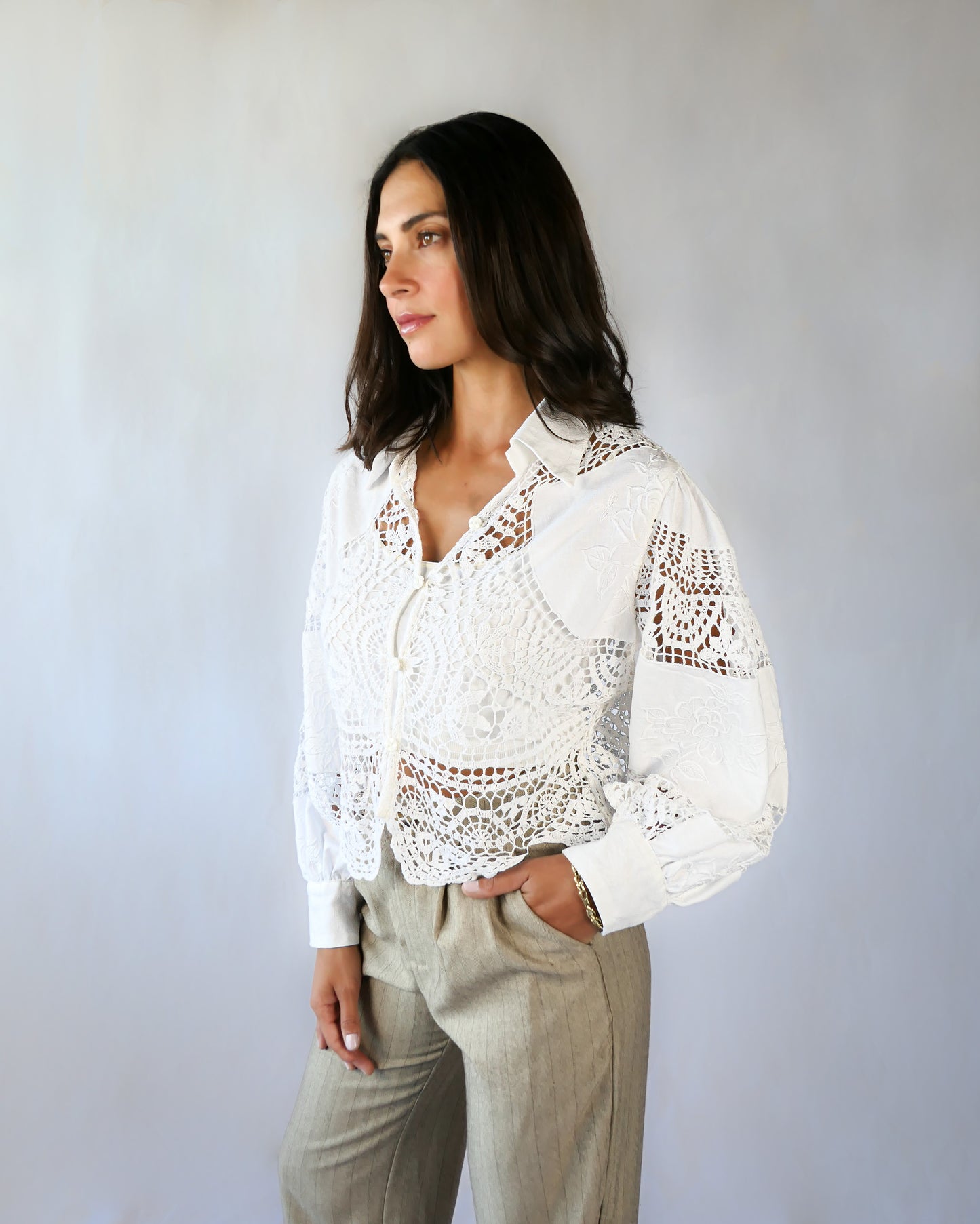 An almost-cropped, lightweight shirt using our vintage Lim's crochet and embroidered cotton fabric, with puff sleeves for a romantic twist. Pair it with high-waisted jeans for casual days, or try it with a flowing midi skirt or wide-legged trousers to dress it up.