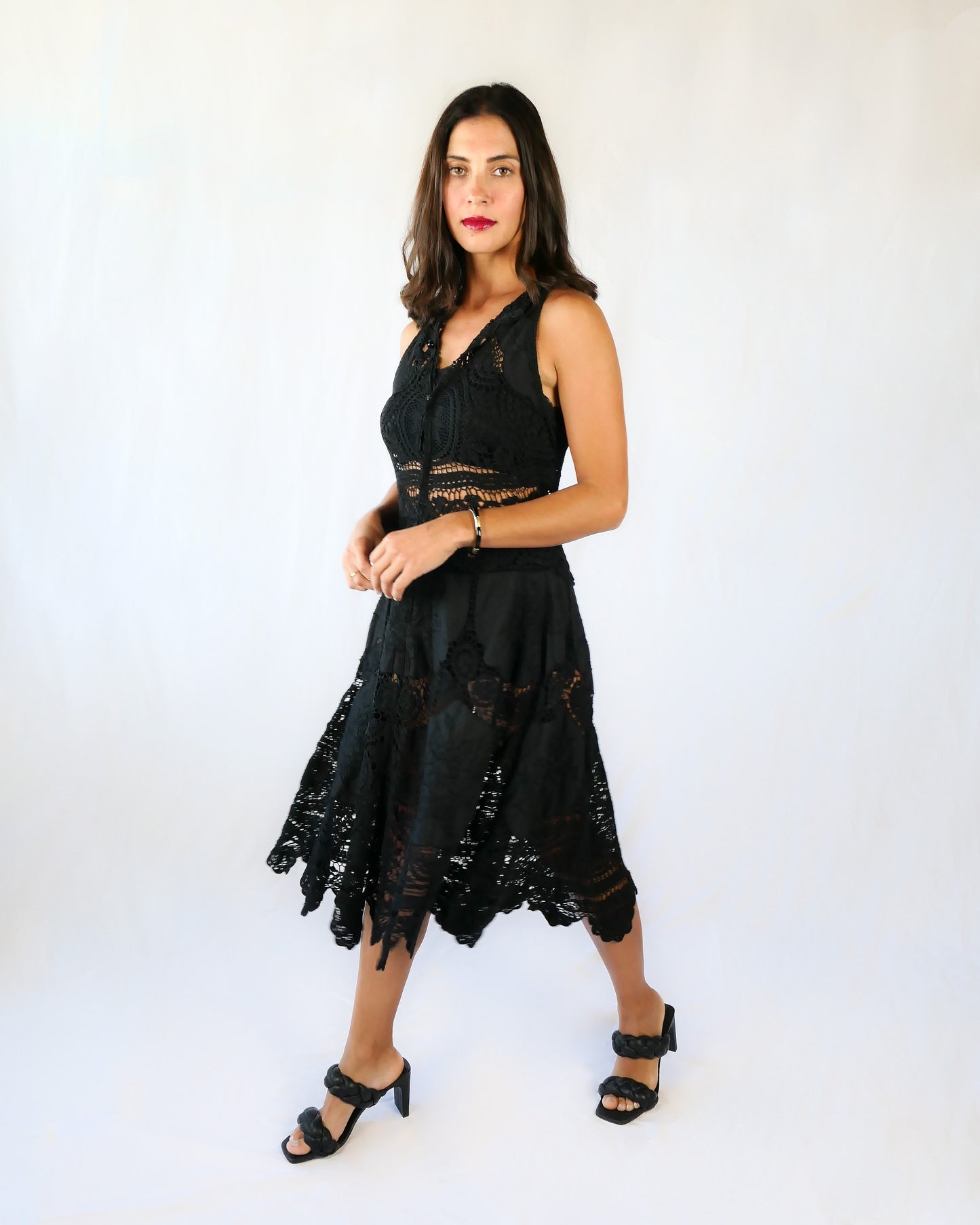 This Little Black Dress with detailed hand crochet and embroidery work lends itself a vintage flair.  The dress can be buttoned up the front or back, has a flattering fit at the waist, and flares out towards the hem.  Wear it as a cocktail dress with black heels or sandals, or as a beach coverup.  