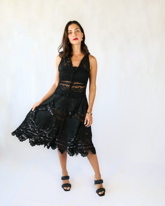 This Little Black Dress with detailed hand crochet and embroidery work lends itself a vintage flair.  The dress can be buttoned up the front or back, has a flattering fit at the waist, and flares out towards the hem.  Wear it as a cocktail dress with black heels or sandals, or as a beach coverup.  