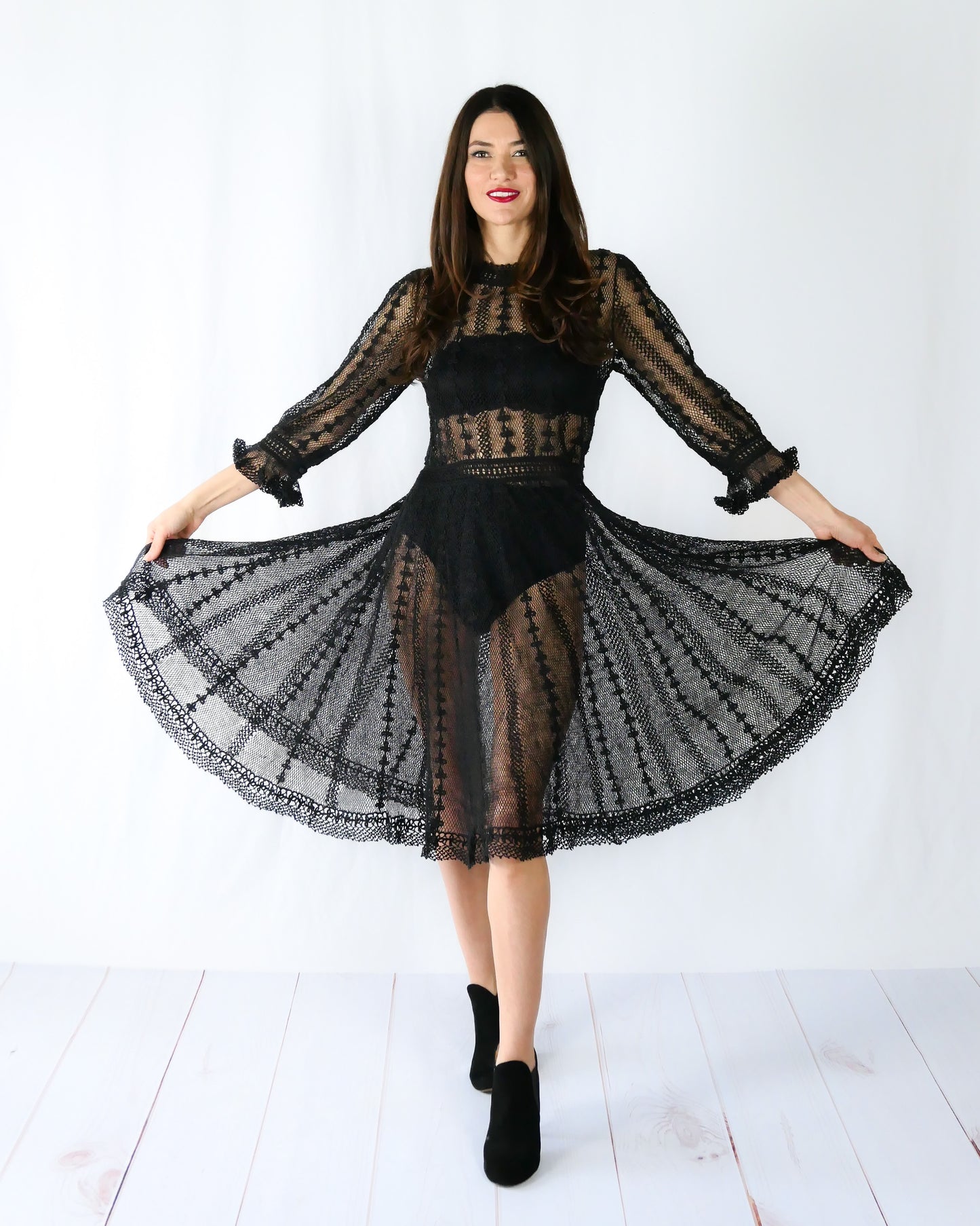 A beguiling black version of our cottage core style midi length crochet dress, this dreamy Lim's original vintage piece from the 1980s is made with very fine threads, creating a refined and sheer look. Detailed crochet trim is used at the waist, hemline, and 3/4 length ruffled sleeves. Measurements: Bust 36” Waist 30” Length 42” Shoulder width 15” Sleeve 20” Cuff circumference 9" Color: Black