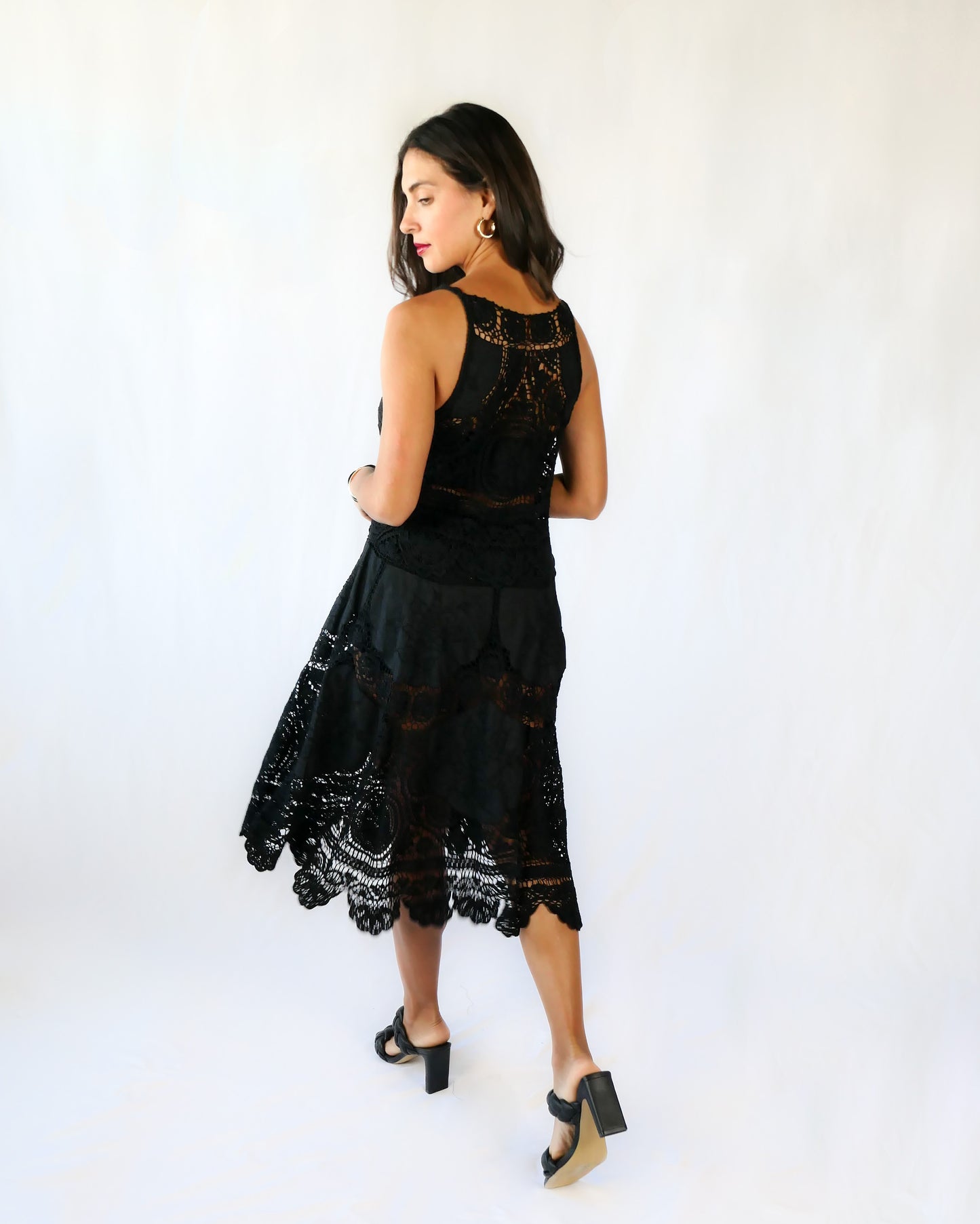 This Little Black Dress with detailed hand crochet and embroidery work lends itself a vintage flair.  The dress can be buttoned up the front or back, has a flattering fit at the waist, and flares out towards the hem.  Wear it as a cocktail dress with black heels or sandals, or as a beach coverup.  