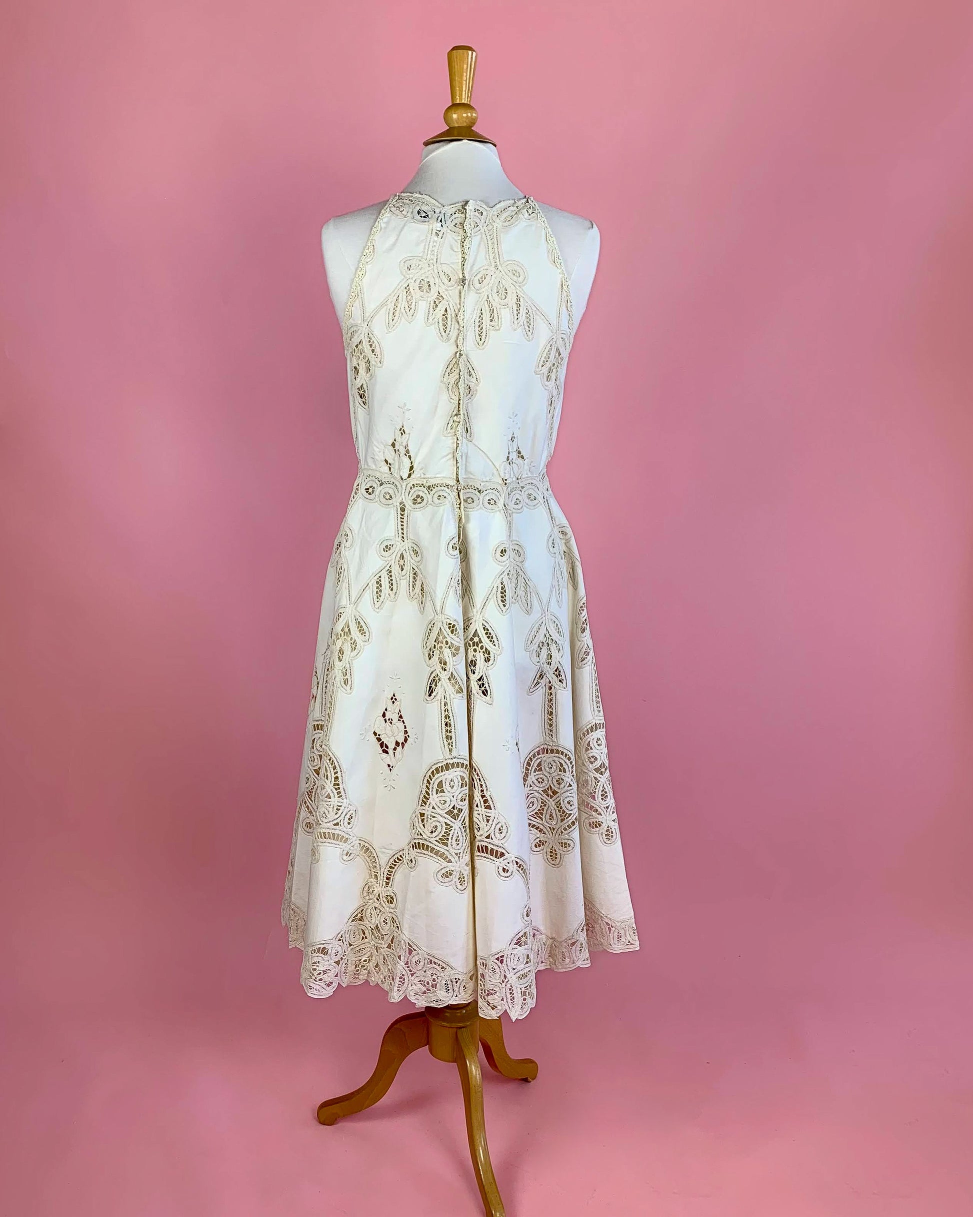 Lim's Vintage Battenberg lace midi length halter dress with a fitted waist and flared skirt.  Buttons up the back.    Measurements: *  Small:  Bust 36"   Waist 30"   Length: 46"     Medium:   Bust 38" Waist 32" Length 46" Large:  Bust 40" Waist 34" Length 46" Color: Natural  Material: 100% cotton