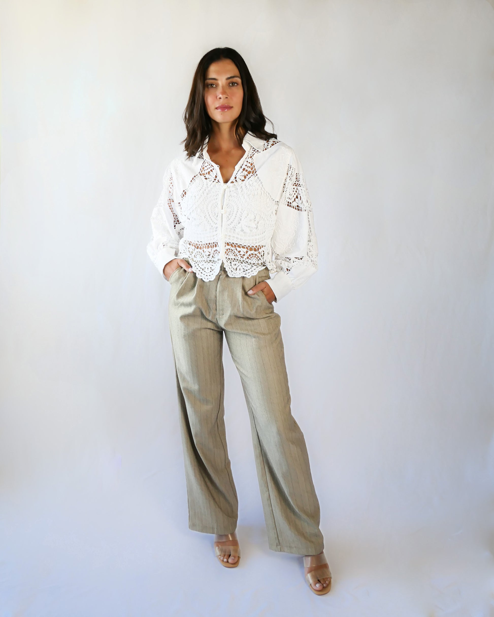 An almost-cropped, lightweight shirt using our vintage Lim's crochet and embroidered cotton fabric, with puff sleeves for a romantic twist. Pair it with high-waisted jeans for casual days, or try it with a flowing midi skirt or wide-legged trousers to dress it up.